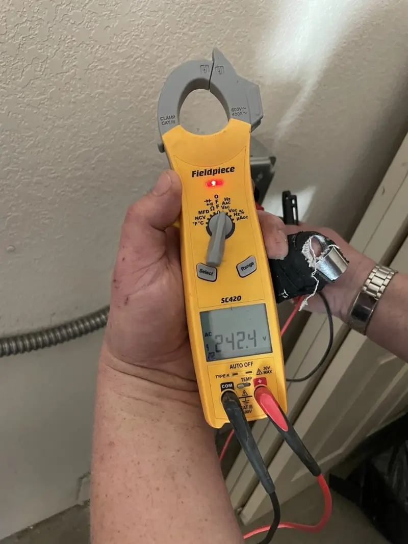 Voltage testing with clamp meter during Electrical Installation Services in Christiana